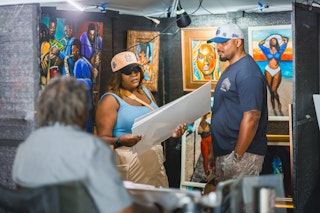 Union Market attendees at art vendor