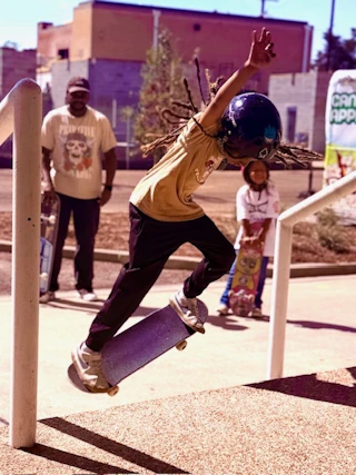 young skateboarder outside Fondren Corner