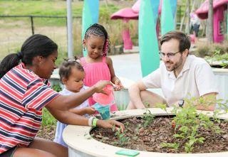 MCM Kids with adult in garden