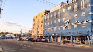 A bright blue and gold multi-storied building